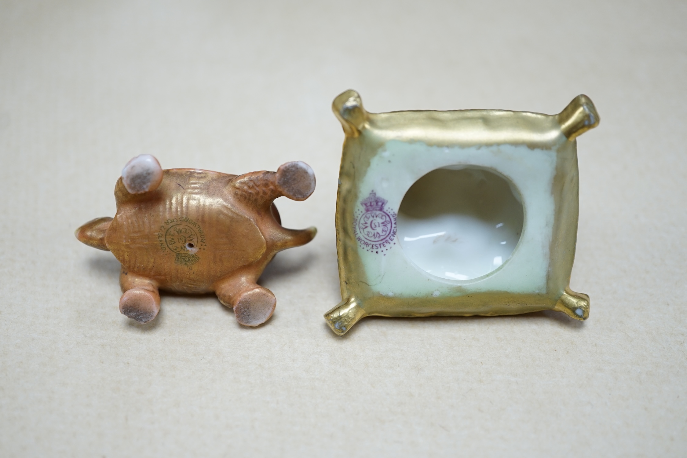 An unusual Royal Worcester miniature King Charles Spaniel sitting on cushion and tortoise, 4cm wide. Condition - fair